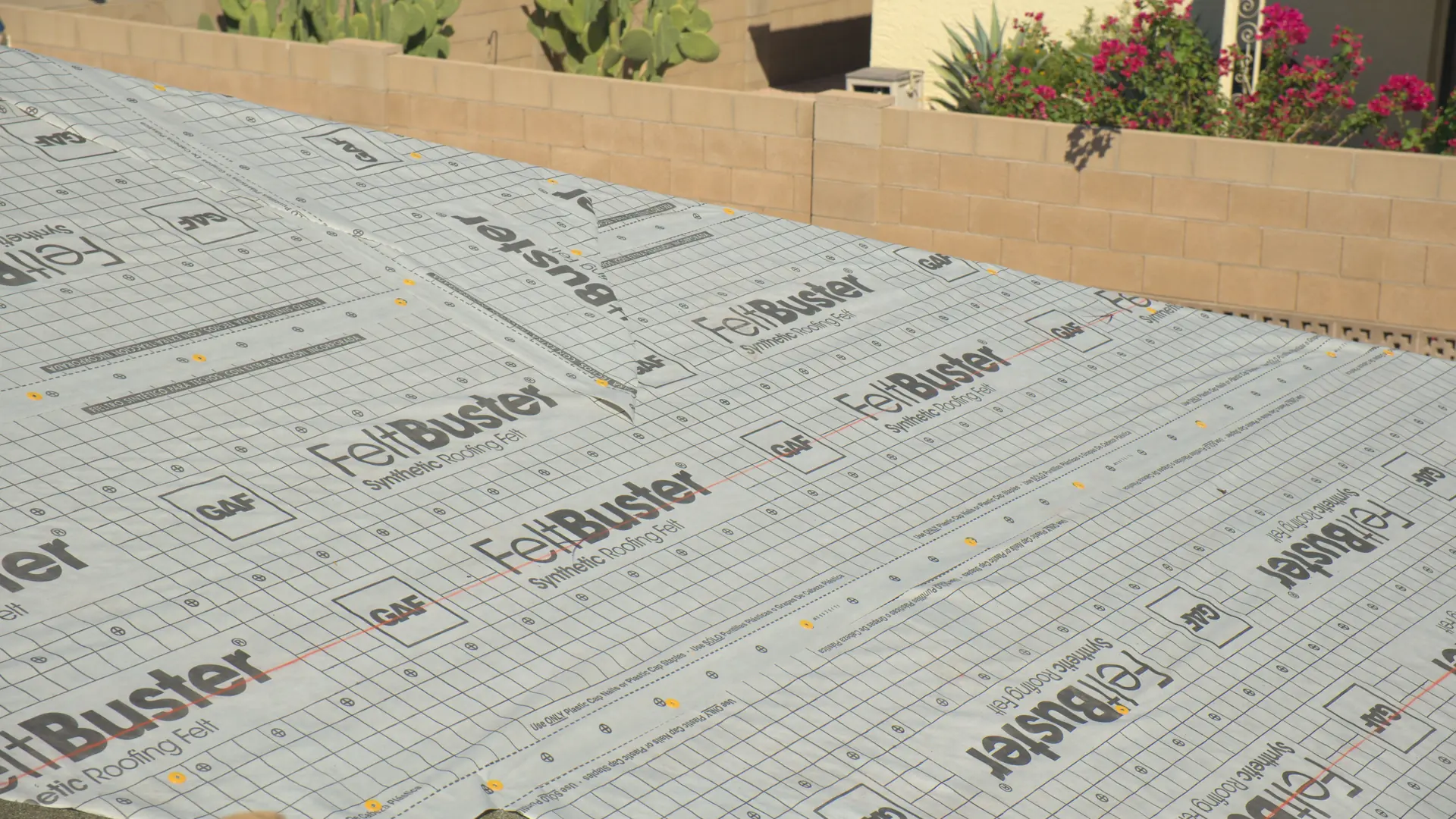 A roof deck covered in new underlayment before shingles go on