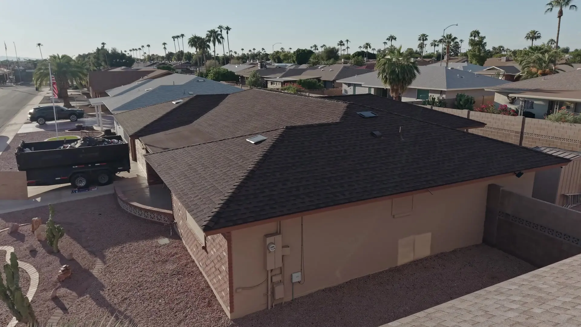 Drone view of a finished roof and the neighborhood around it