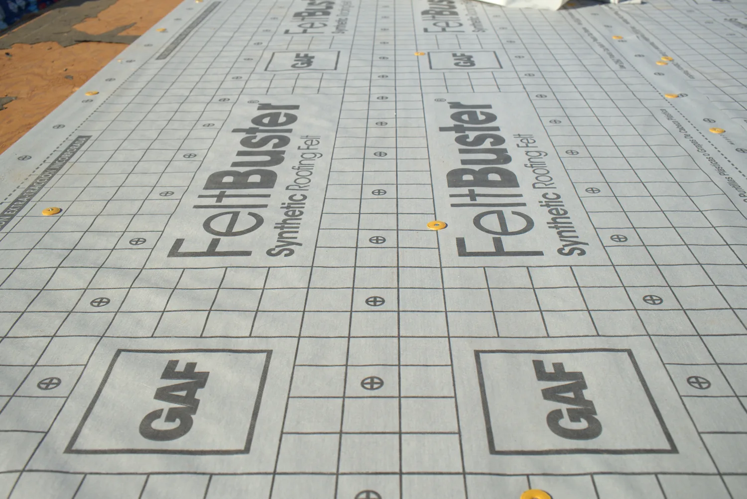 Close view of GAF FeltBuster synthetic roofing felt installed on a roof